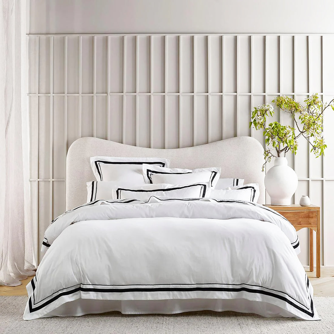 Renee Taylor Cloud 1000 TC Egyptian Cotton Super King Quilt Cover Set: "Elegant Renee Taylor Cloud Super King quilt cover set crafted from 1000 TC Egyptian cotton in white with charcoal trim, featuring lace and embroidery for a luxurious, eco-friendly touch."
